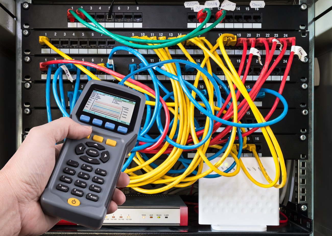 Network test. Qualified cable performance device in human hand detail. Structured cabling. Ethernet