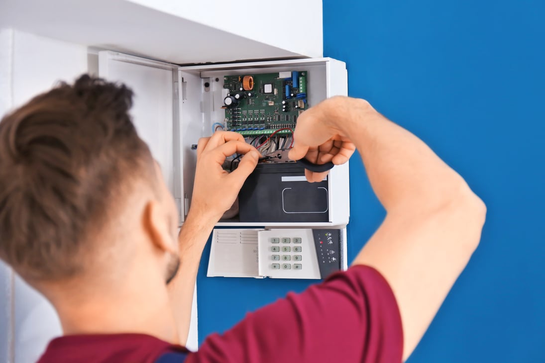 Electrician Installing Alarm System